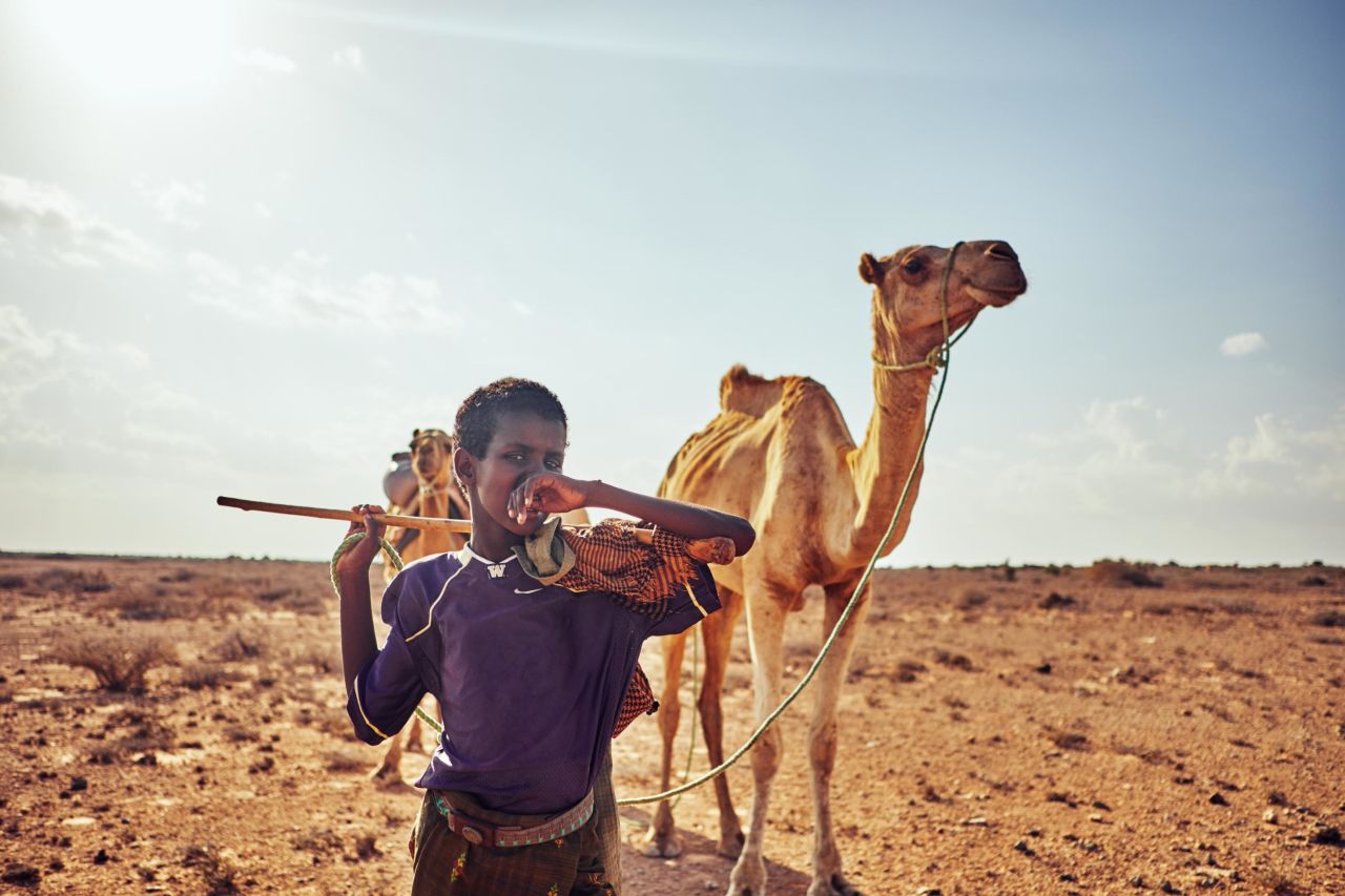 In Nugal, Somalia, <a href="https://www.kmfarah.com/about" target="_blank" target="_blank">Farah</a> highlights Mahad Abdulaziz walking his father's camels from Biyo-Cade to their home several miles away. Biyo-Cade is a secluded village located on the bottom of a dried river valley.