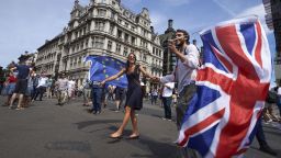 Demonstrators wave the Union Flag as they participate in the People's March demanding a People's Vote on the final Brexit deal, in central London on June 23, 2018, the second anniversary of the 2016 referendum. - Tens of thousands of people demonstrated in London on Saturday calling for a second vote on Britain's departure from the European Union. (Photo by Niklas HALLE'N / AFP)        (Photo credit should read NIKLAS HALLE'N/AFP/Getty Images)