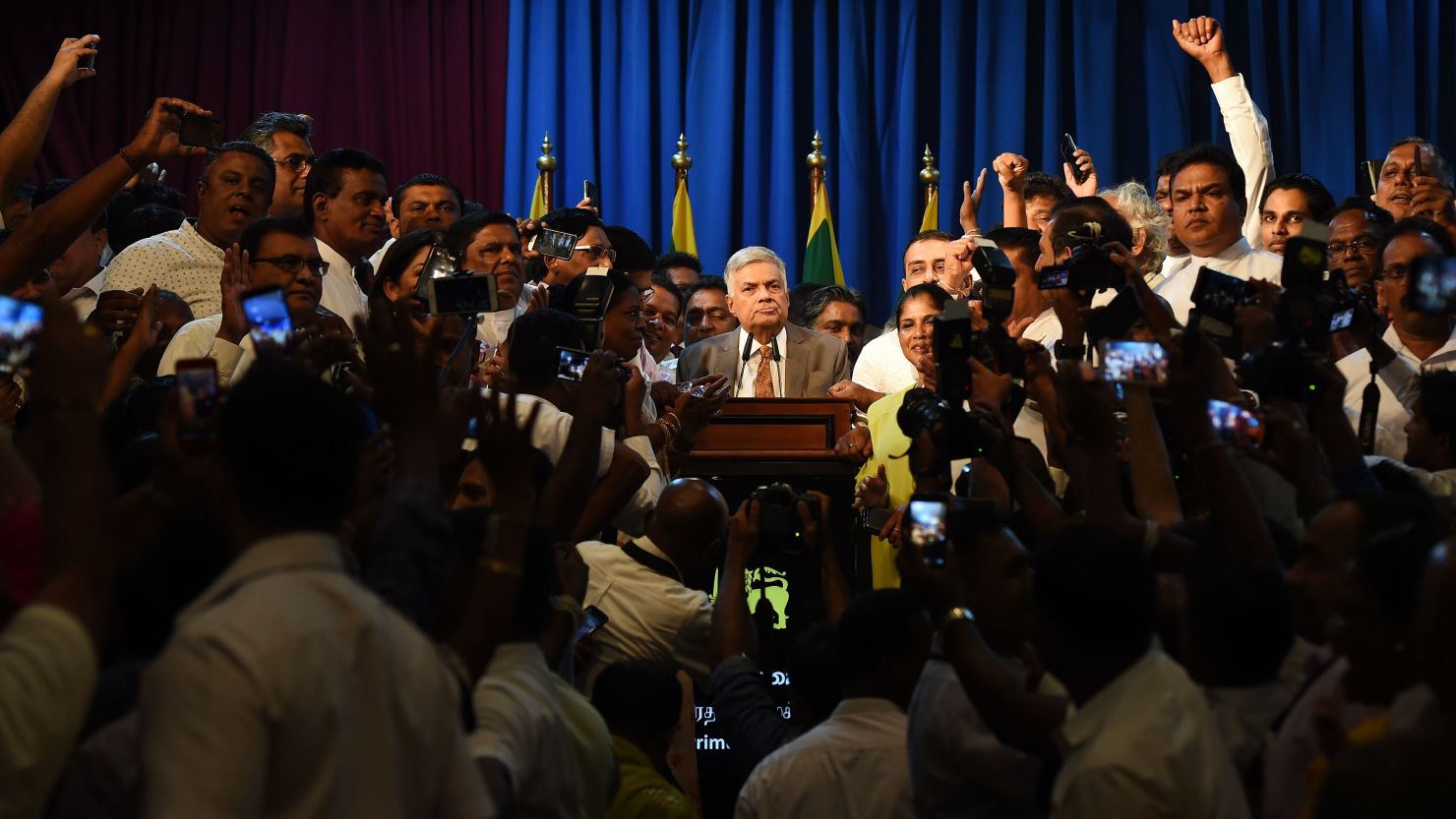Sri Lanka's Prime Minister Ranil Wickremesinghe speaks to supporters at the prime minister's official residence in Colombo on December 16.