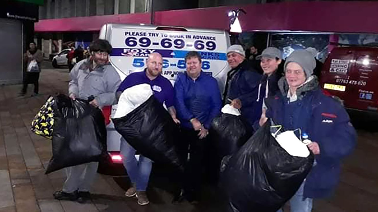 Carl Simpson, third from the left, is the founder of the Raise the Roof Homeless Project, which organized accommodation for 28 homeless people in a hotel over Christmas.