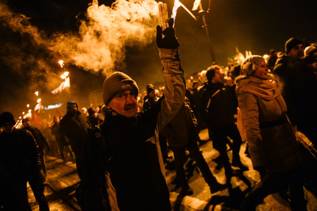 A protester seen holding a burning flare during the protest against on December 16. 