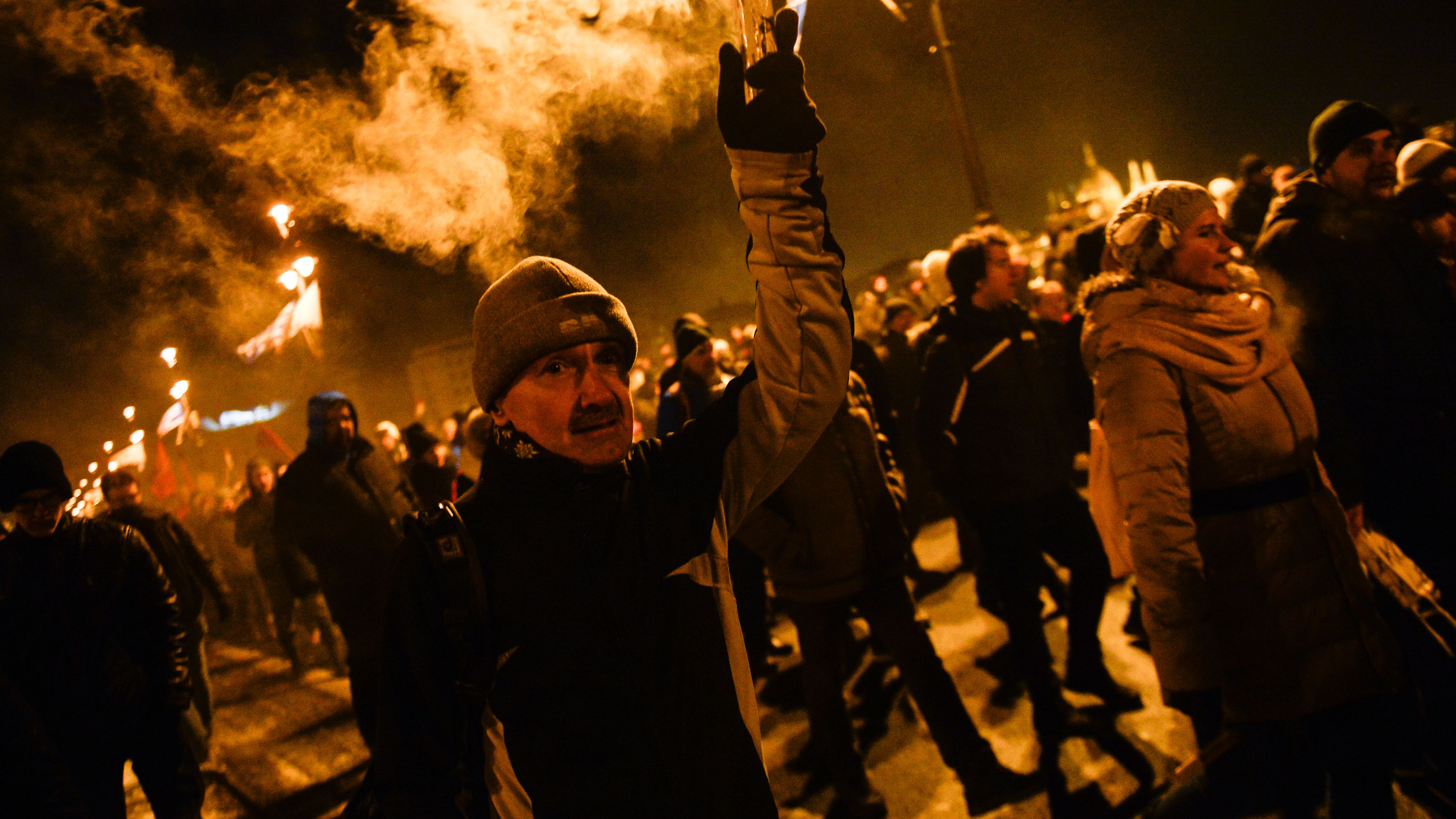 A protester seen holding a burning flare during the protest against on December 16. 