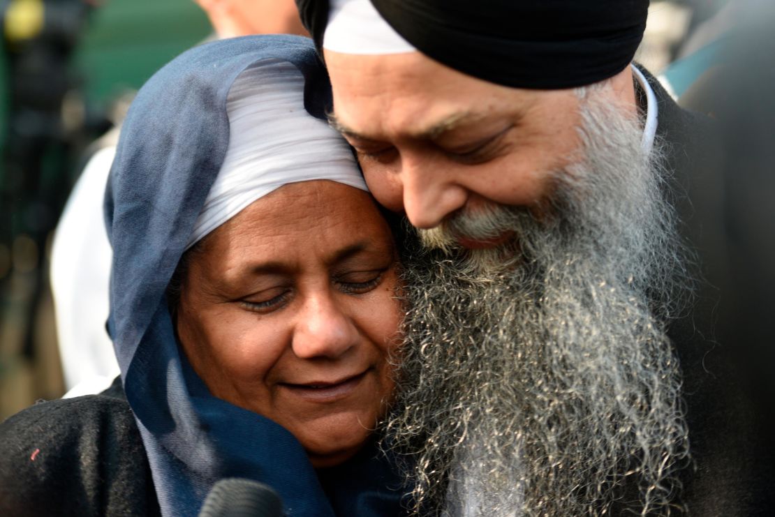 Nirpreet Kaur, an eyewitness to the 1984 Sikh massacre, is seen with AAP leader Jarnail Singh outside the Delhi High Court after  Kumar was sentenced to life imprisonment Monday.