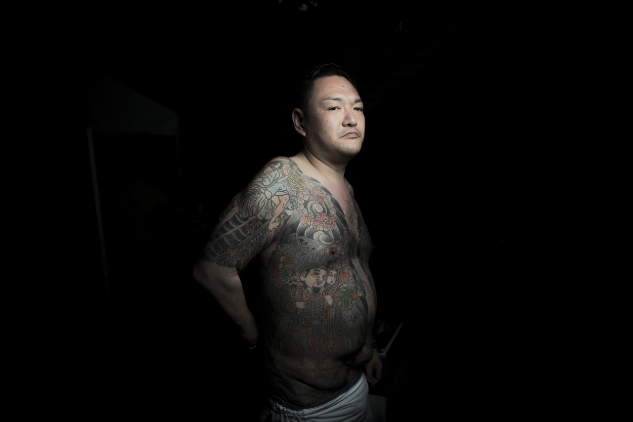 A man shows his traditional-style Japanese tattoos during the Sanja Matsuri festival in Tokyo. Over 1.5 million people flocked to Tokyo's Asakusa district during the three-day annual festival, which heralds the coming of summer in the Japanese capital. 