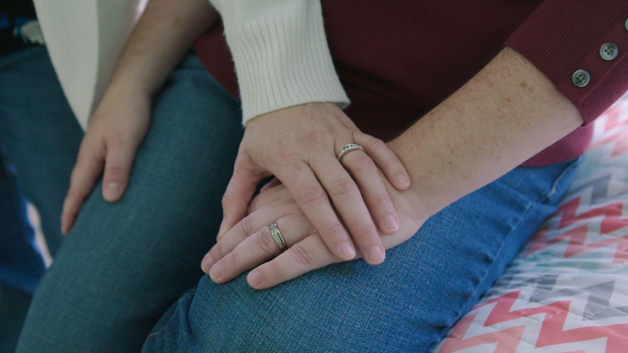 Kristy and Dana Dumont are challenging the state's practice of letting contractors use religious criteria to screen families.
