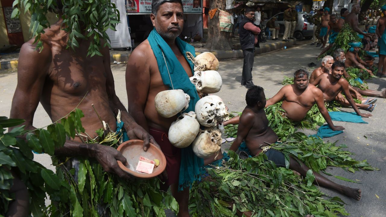 Indian farmers from the southern state of Tamil Nadu wear tree leaves and hold symbolic skulls as they take part in a protest in New Delhi on March 16, 2017. 