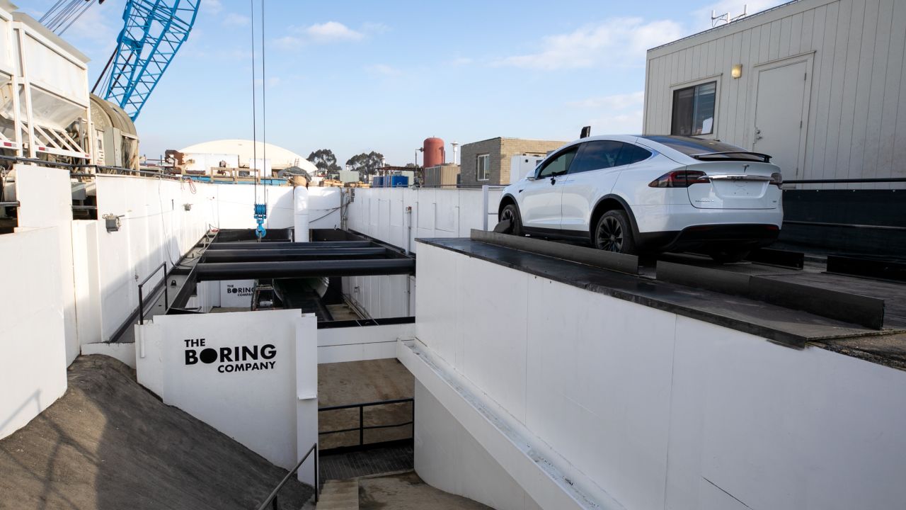 The Boring Company has dug an entrance to its test tunnel in a corner of SpaceX's parking lot.