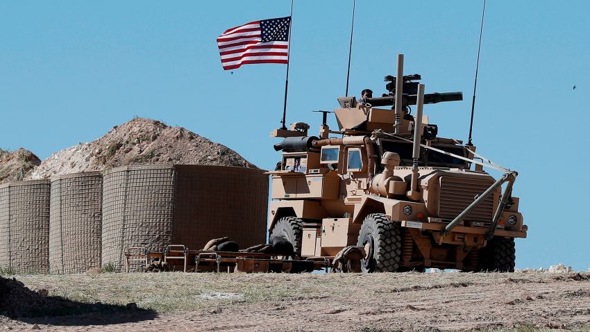 FIEL - In this April 4, 2018, file photo, a U.S. soldier sits on an armored vehicle on a newly installed position, near front line between the U.S-backed Syrian Manbij Military Council and the Turkish-backed fighters, in Manbij, north Syria. The drama of U.S. and allied missiles strikes on Syria has obscured the fact that the U.S.-led campaign to eliminate the Islamic State from Syria has stalled. This is an illustration of the many-layered complexities of the Syrian conflict.  (AP Photo/Hussein Malla, File)