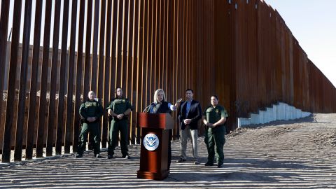U.S. Department of Homeland Security Secretary Kirstjen Nielsen, center, speaks in front of a newly fortified border wall structure Friday, Oct. 26, 2018, in Calexico, Calif. 