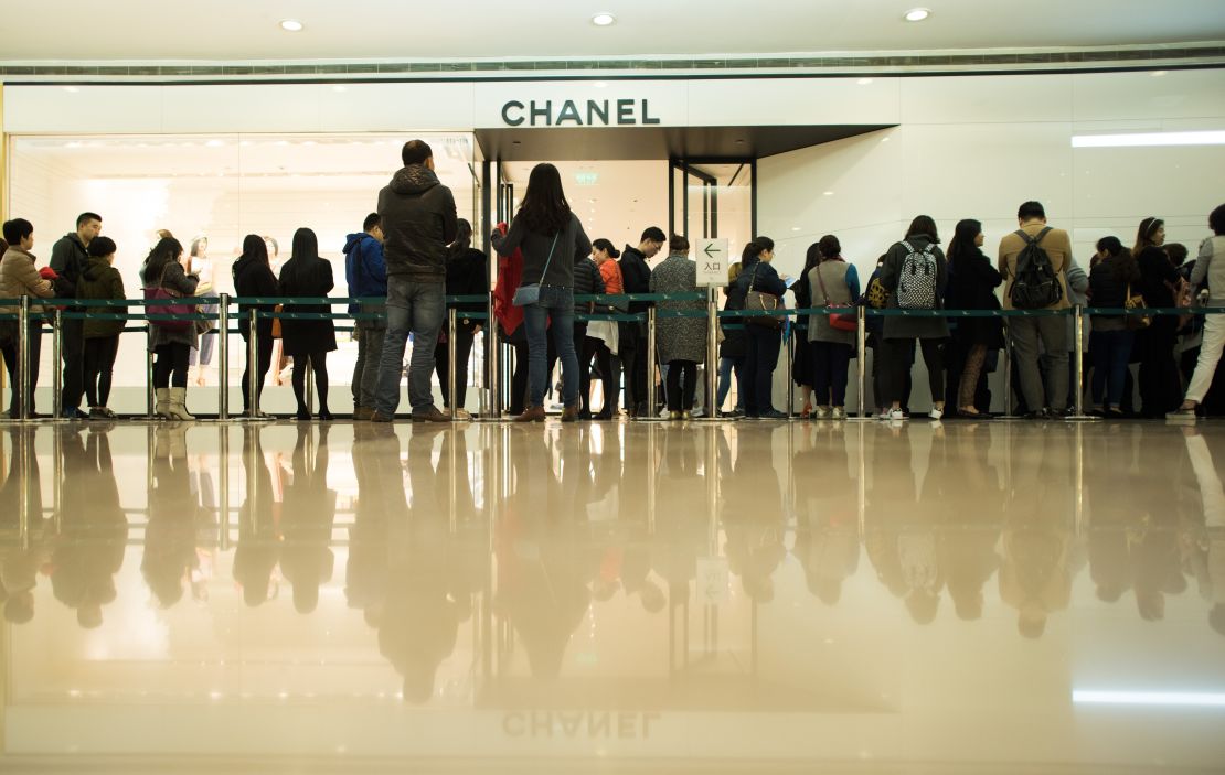 People queuing outside a Chanel store in downtown Shanghai. 