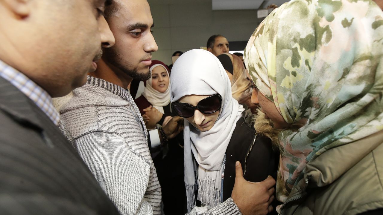 Shaima Swileh (center) arrived at San Francisco International Airport Wednesday night.