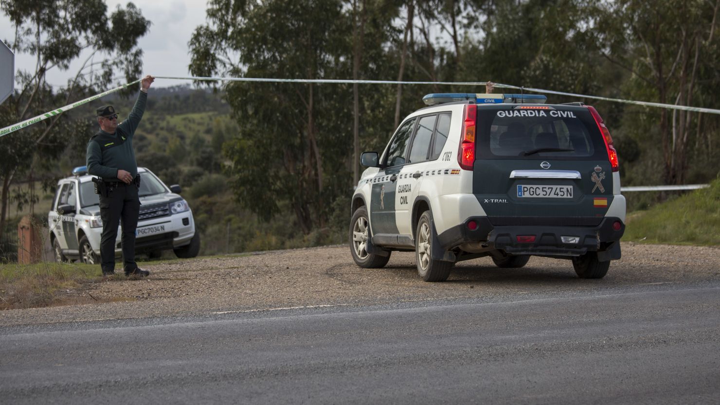 Authorities search a ravine Monday where Laura Luelmo's body was found in Spain's Huelva province.