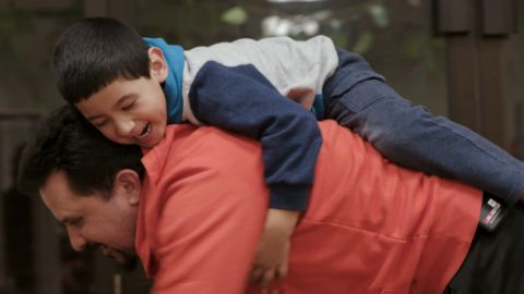 Nelson Pinos plays with son Brandon
