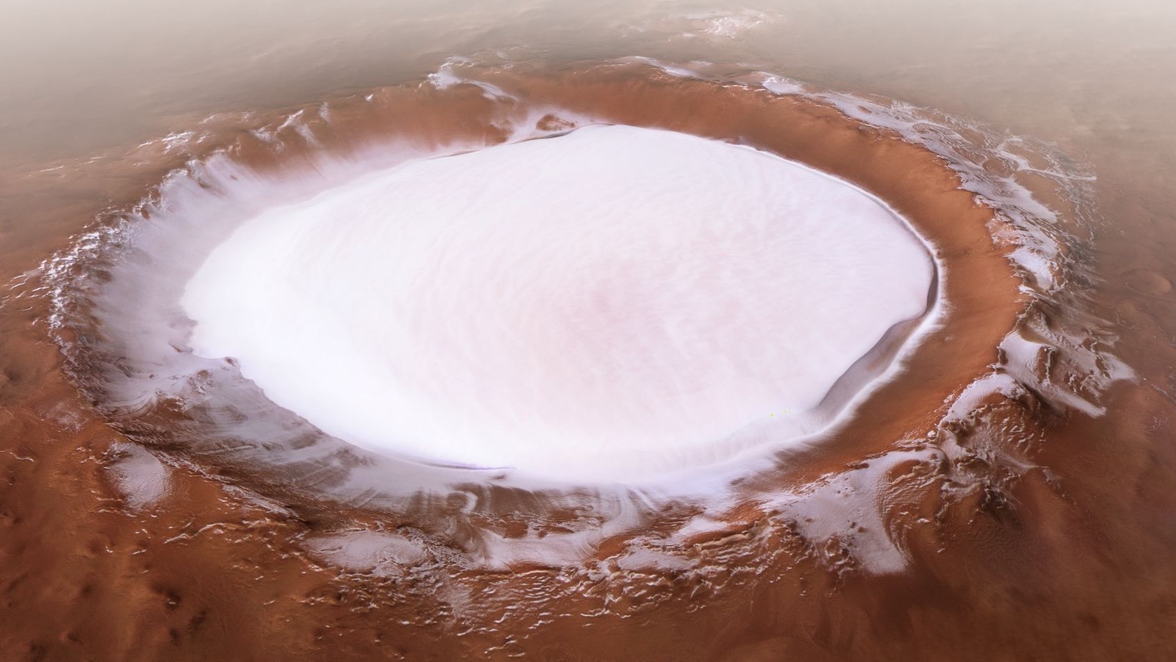 Ice can be found in multiple places on the cold planet. The European Space Agency's Mars Express mission captured this image of the Korolev crater, more than 50 miles across and filled with water ice, near the north pole.