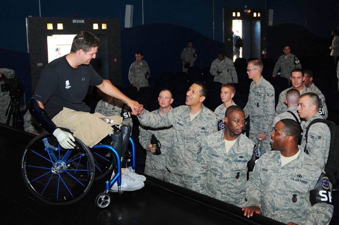 Brian Kolfage meets with American airmen at a military base in Germany in 2012.