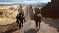 NOGALES, AZ - MARCH 08:  U.S. Border Patrol ranch liaison John "Cody" Jackson (R) rides with cattle rancher Dan Bell on Bell's ZZ Cattle Ranch at the U.S.-Mexico border on March 8, 2013 in Nogales, Arizona. Jackson meets regularly with local ranchers to coordinate the agency's efforts on border issues, including drug smuggling and illegal immigration from Mexico. Bell, a third generation rancher, grazes cattle on nearly ten miles of border property.  (Photo by John Moore/Getty Images)