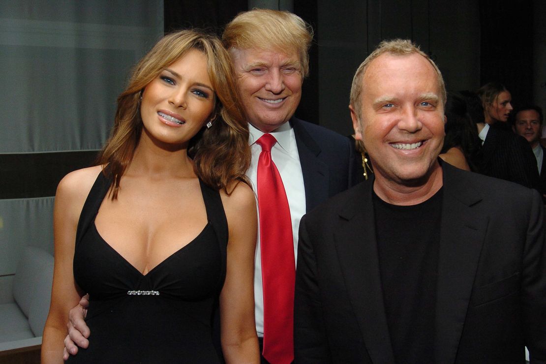 Melania and Donald Trump pose with fashion designer Michael Kors at a party at Jean-George in the West Village in New York in 2005.