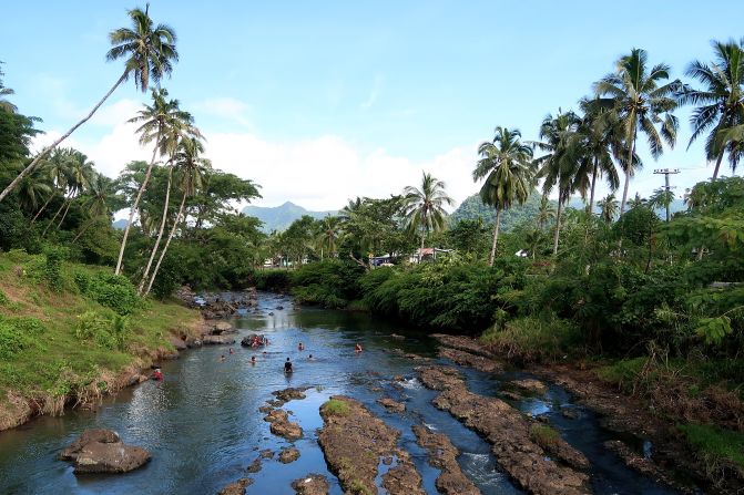 <strong>Samoa:</strong> It's not just the ocean that's an eye-catching water feature. Here, children play in a river in Apia, the capital of Samoa. 