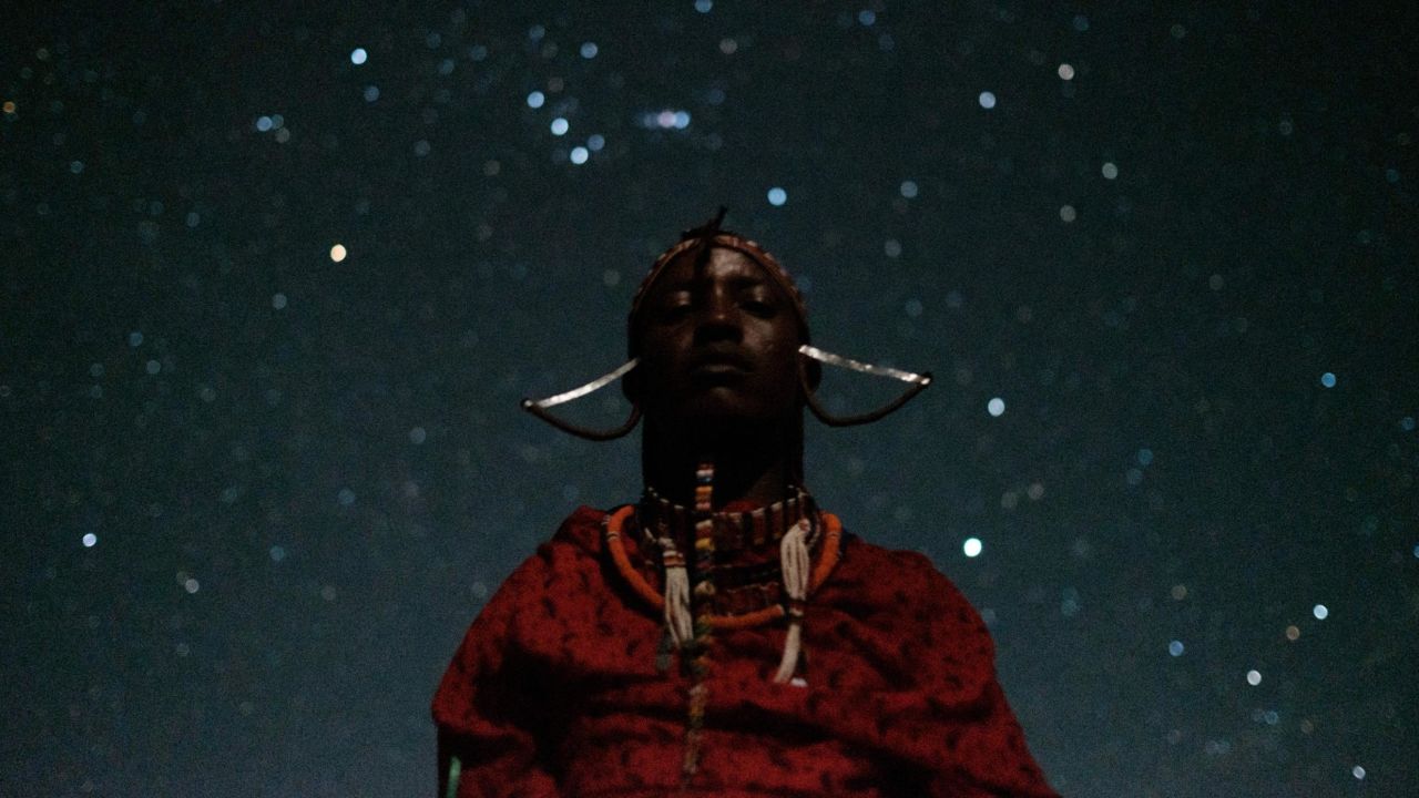 A Maasai warrior in Kimana, Kenya, poses at the site of a sporting event dubbed the Maasai Olympics on Friday, December 14. The Maasai Olympics, an initiative of international conservation groups, offers the ethnic group's warriors an alternative to killing lions as part of their traditional rite of passage.