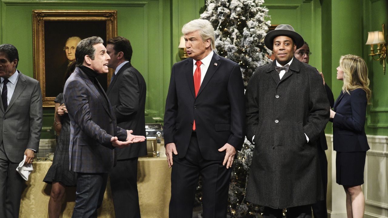 Alec Baldwin plays US President Donald Trump in a "Saturday Night Live" skit on December 15. <a href="https://www.cnn.com/2018/12/16/media/trump-snl-christmas-wonderful-life/index.html" target="_blank">The skit</a> was a takeoff of the classic film "It's a Wonderful Life," and it pretended to show what life was like if Trump were never President. Ben Stiller, left, played Trump's former lawyer Michael Cohen. Kenan Thompson, right, played Trump's guardian angel.