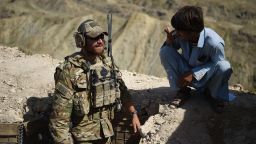 In this photo taken on July 7, 2018, A US Army soldier from NATO and an Afghan Local Police (ALP) look on in a checkpoint during a patrol against Islamic State militants at the Deh Bala district in the eastern province of Nangarhar Province. - A US soldier was killed and two others wounded in an "apparent insider attack" in southern Afghanistan on July 8, NATO said, the first such killing in nearly a year. (Photo by WAKIL KOHSAR / AFP)        (Photo credit should read WAKIL KOHSAR/AFP/Getty Images)