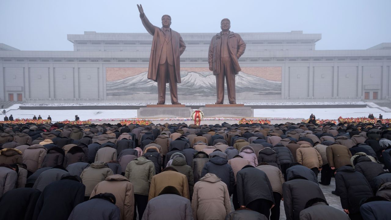 Residents of Pyongyang, North Korea, bow before statues of former leaders Kim Il Sung and Kim Jong Il on Monday, December 17. It was the seventh anniversary of the latter's death.