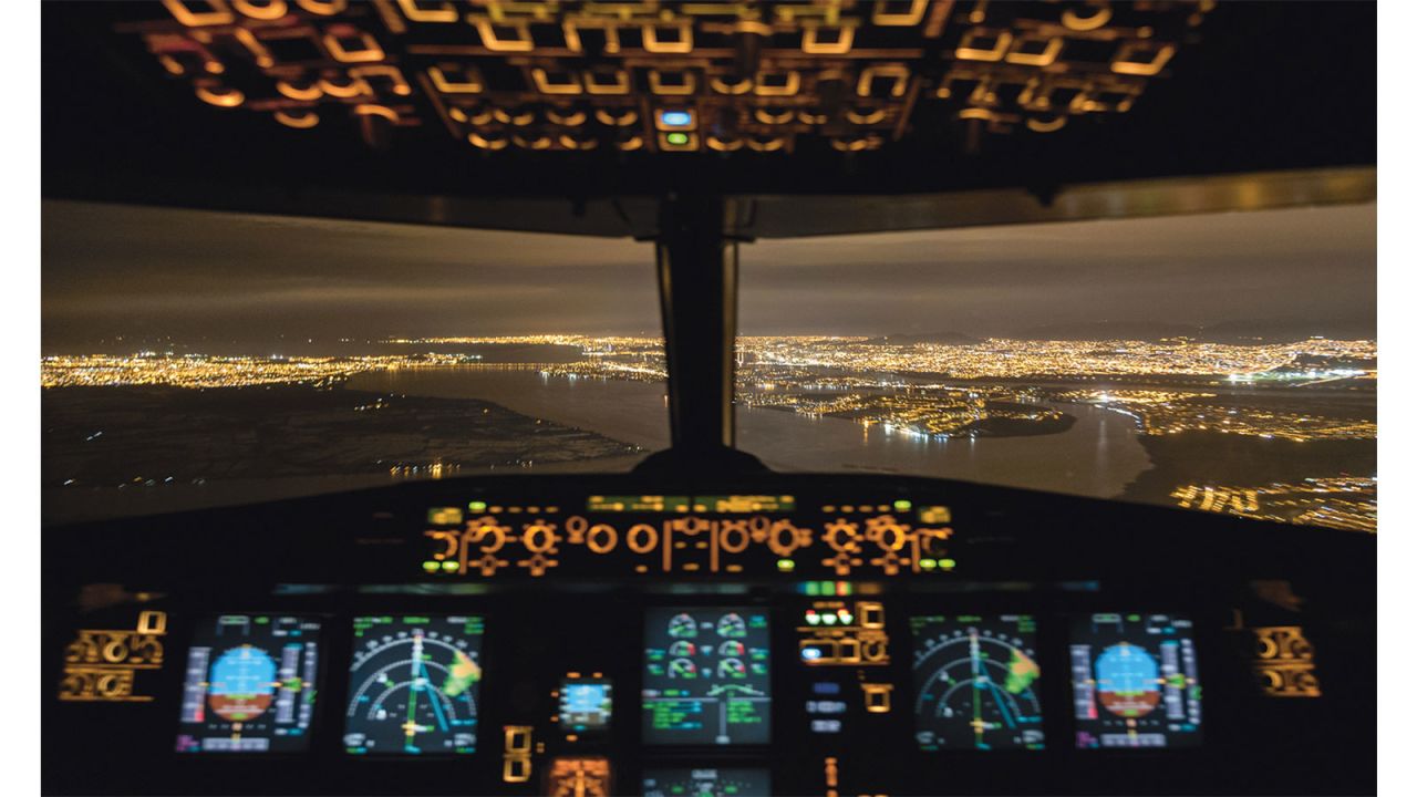 Pilot Santiago Borja takes photographs of storms from the airplane cockpit.