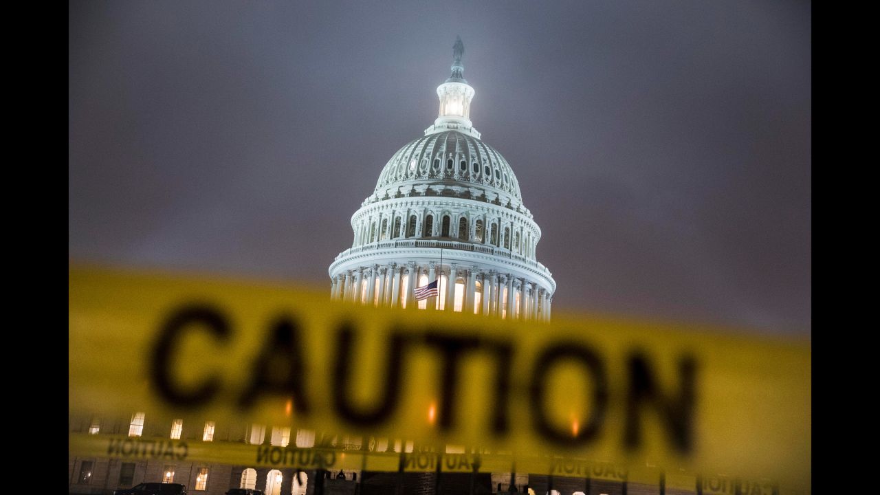 The West Front of the US Capitol is seen on Thursday, December 20, with caution tape draped around a fence. President Donald Trump <a href="https://www.cnn.com/2018/12/20/politics/donald-trump-shutdown-border-wall-funding/index.html" target="_blank">reversed course this week</a> and signaled he would rather partially shut down the federal government than give up his fight for a spending bill that includes $5 billion needed to build a wall along the US-Mexico border.