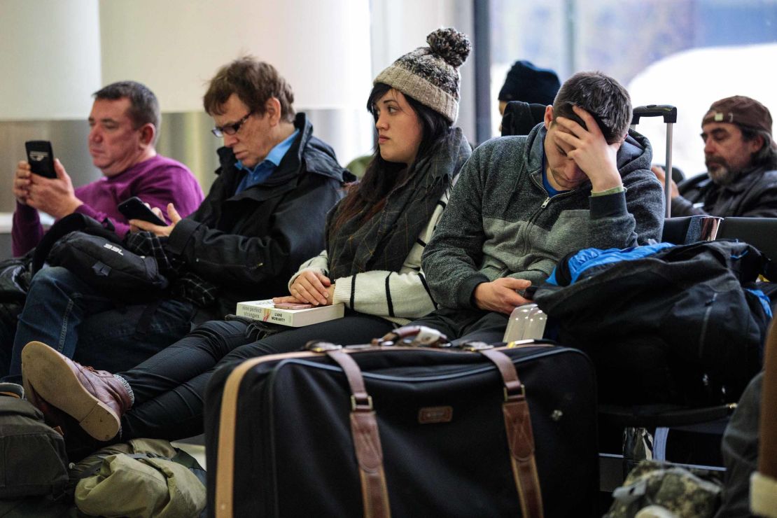 Passengers wait in the South Terminal building at London Gatwick Airport after flights resumed Friday.