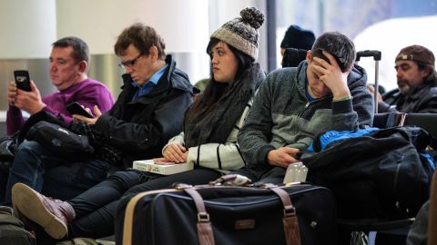 Passengers wait in the South Terminal building at London Gatwick Airport after flights resumed Friday.