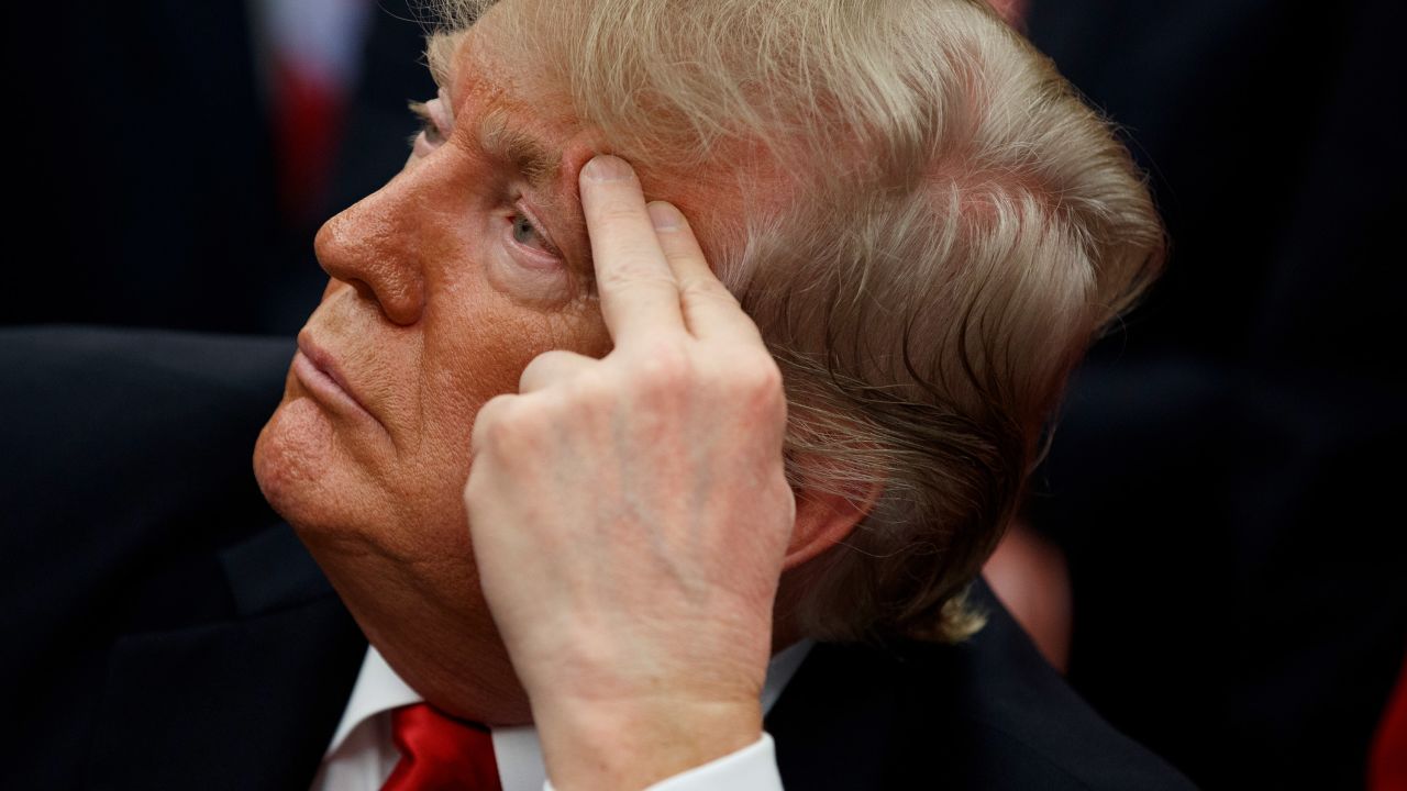 President Donald Trump listens during a signing ceremony for the "First Step Act" and "Juvenile Justice Reform Act," in the Oval Office of the White House, Friday, Dec. 21, 2018, in Washington. (AP Photo/Evan Vucci)