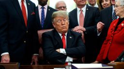 President Donald Trump listens during a signing ceremony for criminal justice reform legislation in the Oval Office of the White House, Friday, Dec. 21, 2018, in Washington. (AP Photo/Evan Vucci)