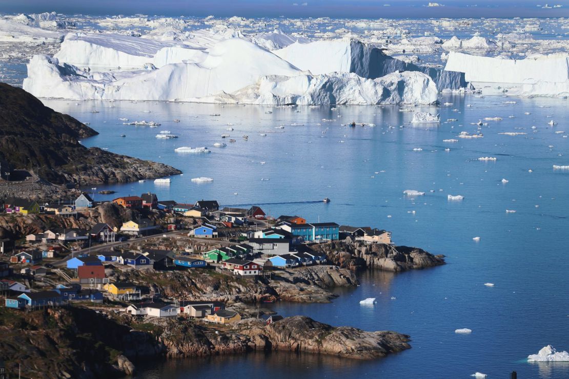 Icebergs breaking off a glacier in Greenland. 