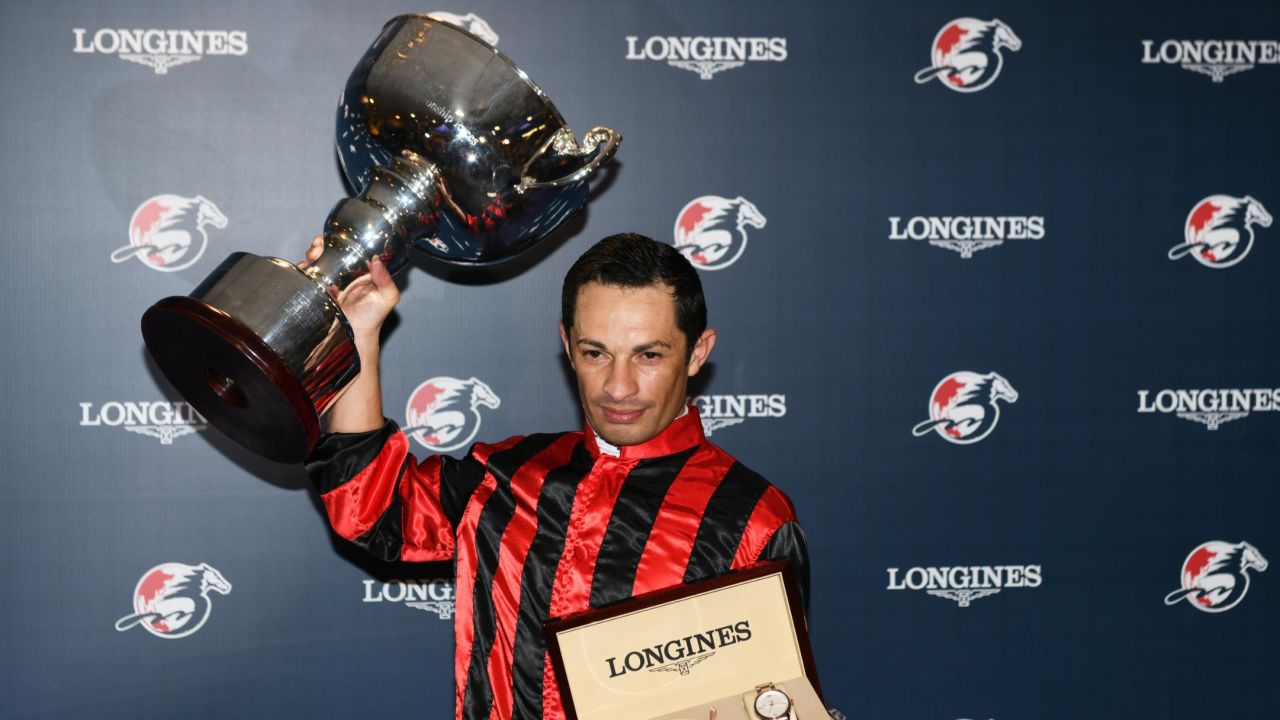 HONG KONG, HONG KONG - DECEMBER 05: Silvestre De Sousa representing Great Britain poses with the trophy after winning championship during the LONGINES International Jockeys' Championship at Happy Valley Racecourse on December 05, 2018 in Hong Kong. (Photo by Vince Caligiuri/Getty Images)