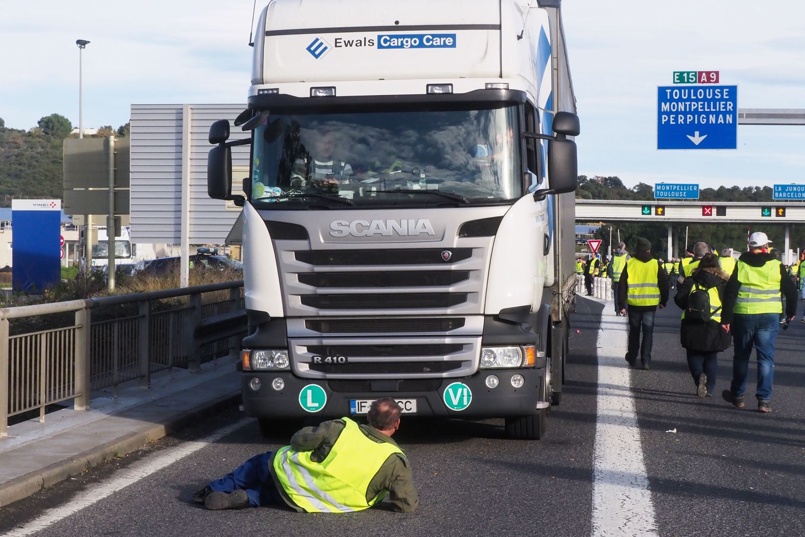 Demonstators turn out December 22 near toll booths on the A9 highway in Le Boulou, France.