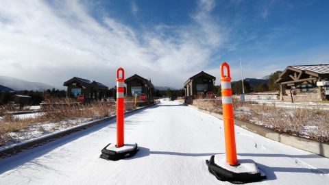 A lane is blocked to an unattended toll booth at Rocky Mountain National Park Saturday, December 22, in Estes Park, Colo. A partial federal shutdown has been put in motion because of gridlock in Congress over funding for President Donald Trump's Mexican border wall. The gridlock blocks money for nine of 15 Cabinet-level departments and dozens of agencies including the departments of Homeland Security, Transportation, Interior, Agriculture, State and Justice.