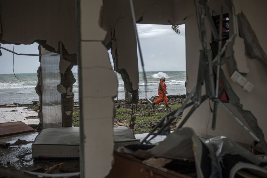A rescuer takes part in a search for tsunami victims in Carita, Indonesia.