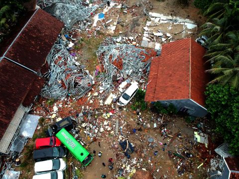 An aerial photo shows damaged buildings in Carita, Indonesia, on Sunday, a day after the area was hit by the tsunami.