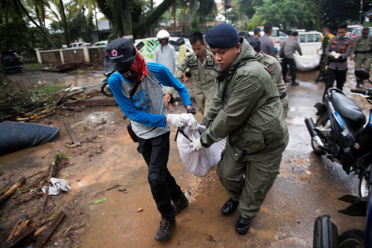 Rescue team members carry the body of a tsunami victim in Banten, Indonesia, on Sunday.
