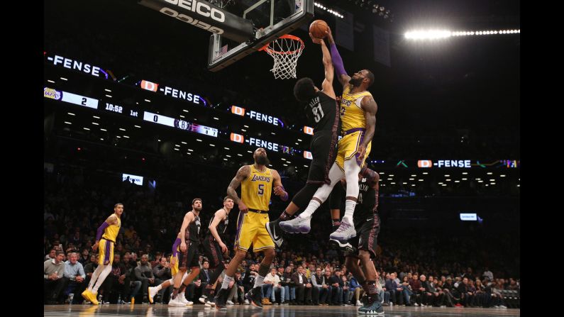 Brooklyn Nets center Jarrett Allen blocks a dunk attempt by LeBron James of the Los Angeles Lakers during the first quarter of their basketball game in Brooklyn, New York on December 18. According to ESPN Stats & Info, <a href="index.php?page=&url=https%3A%2F%2Fbleacherreport.com%2Farticles%2F2811511-lebron-james-jarrett-allens-block-probably-all-over-social-media" target="_blank" target="_blank">it was only the ninth time James was blocked in 1,850 career dunk attempts.</a>
