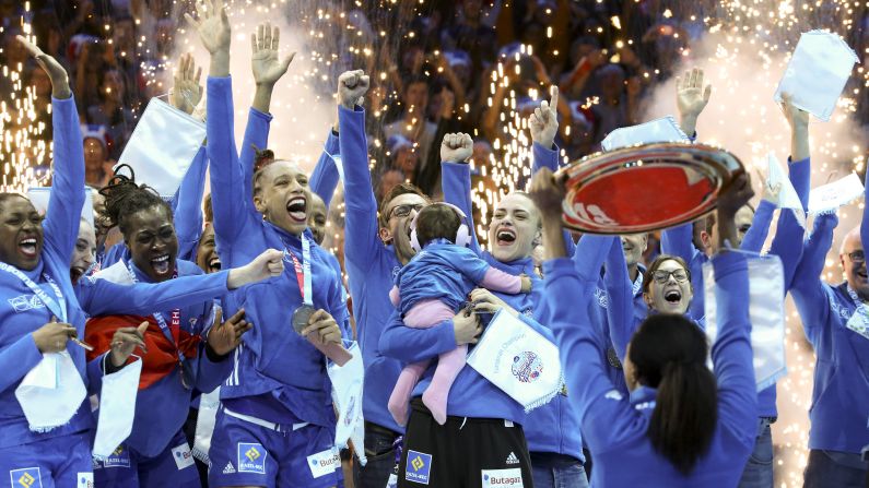 French players celebrate their EHF EURO European Women's Handball Championship victory at AccorHotels Arena on Sunday December 16 in Paris, France. France won the final match over Russia 24-21 to claim the gold.