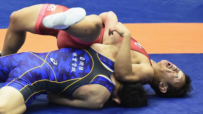 Ryota Nasukawa (in red) competes against Takahiro Tsuruda during the men's 87kg Greco-Roman match on day one of the Emperor's Cup All Japan Wrestling Championships at Komazawa Gymnasium on December 20 in Tokyo, Japan.