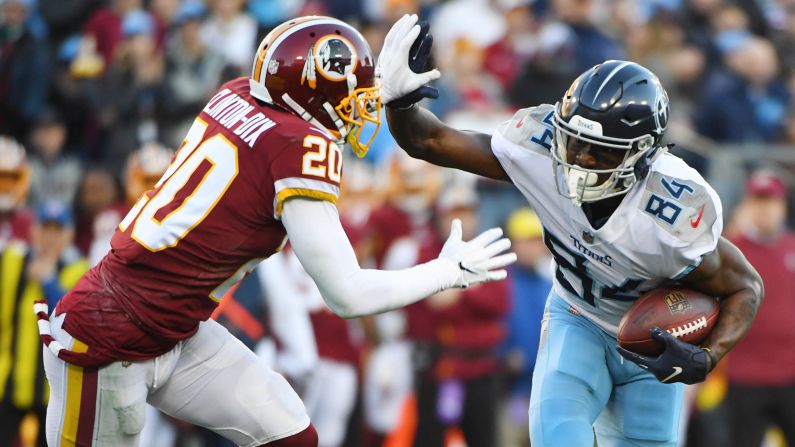 Tennessee Titans wide receiver Corey Davis fights off a tackle attempt from Washington Redskins strong safety Ha Ha Clinton-Dix during the first half of their December 22 game at Nissan Stadium in Nashville, Tennessee. The Titans won the game 25-16 to keep their playoff hopes alive.