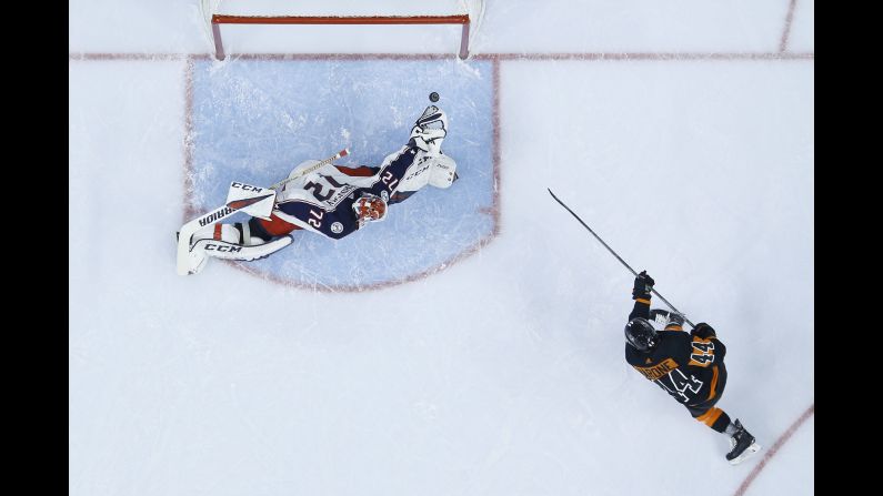 Philadelphia Flyers' Phil Varone scores a goal past Columbus Blue Jackets goaltender Sergei Bobrovsky during the second period of an NHL hockey game on December 22 in Philadelphia, Pennsylvania.