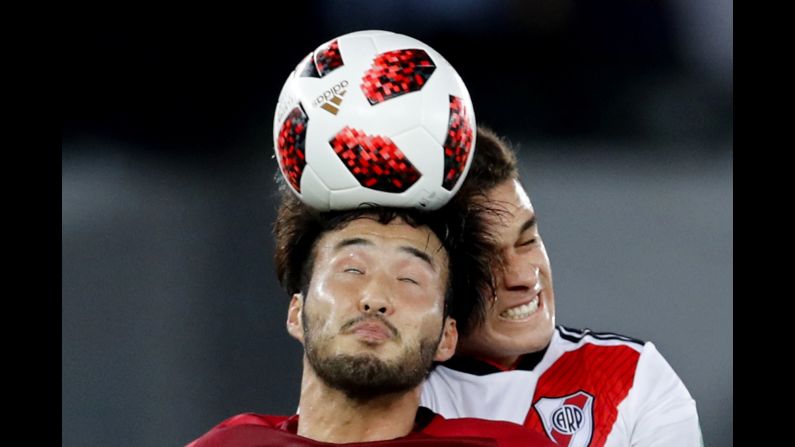 Tomoya Inukai of the Kashima Antlers and Rafael Santos Borre of River Plate battle over the ball during the Club World Cup third place soccer match at Zayed Sport City in Abu Dhabi, United Arab Emirates on December 22.
