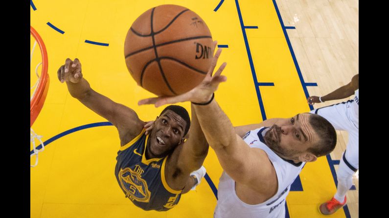 Golden State Warriors forward Kevon Looney and Memphis Grizzlies center Marc Gasol fight for a rebound during the first half of their game at Oracle Arena on December 17. The Warriors defeated the Grizzlies 110-93.