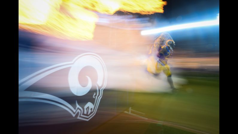 Inside linebacker Mark Barron of the Los Angeles Rams runs onto the field ahead of a game against the Philadelphia Eagles at StubHub Center in Carson, California on December 16.