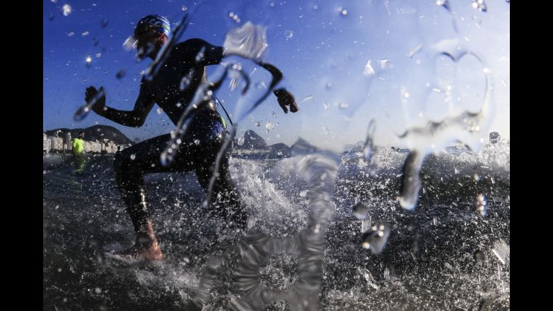 An athlete finishes the men's open water swimming competition during the Rei e Rainha do Mar at Copacabana Beach on December 22, in Rio de Janeiro, Brazil.