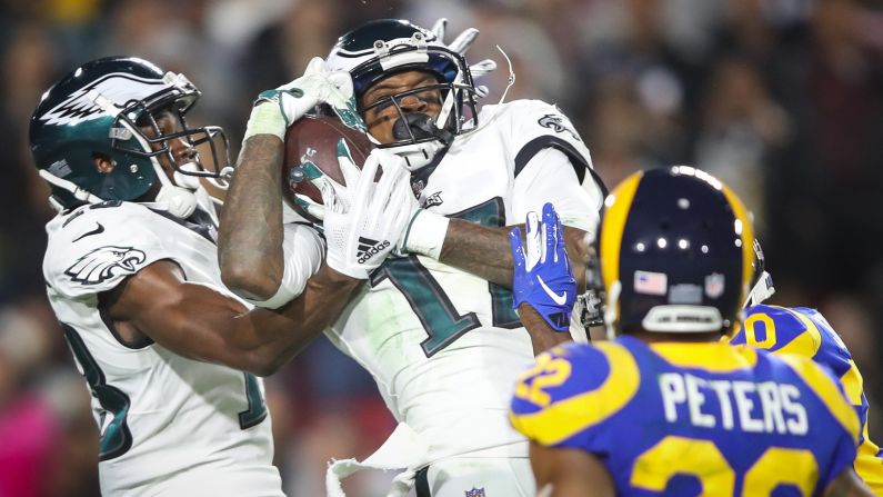 Wide receiver Alshon Jeffery of the Philadelphia Eagles collides with his teammate while making a first-down catch in the third quarter of their game against the Los Angeles Rams at Los Angeles Memorial Coliseum on December 16. <a  target="_blank">See 31 amazing sports photos from last week.</a>