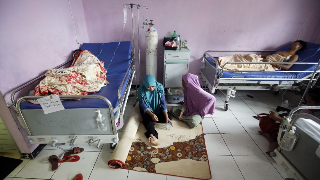 Tsunami survivors rest at a hospital in Pandeglang, Indonesia, Monday. Doctors are working to help survivors, and rescuers are looking for more victims from a deadly tsunami that smashed into beachside buildings along an Indonesian strait. 